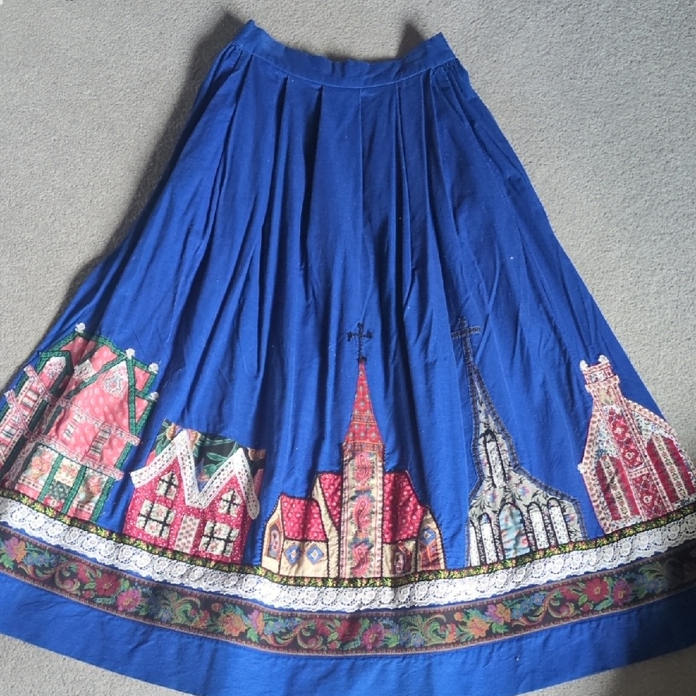 Blue Pleated Midi Skirt with Embellished Architectural Print